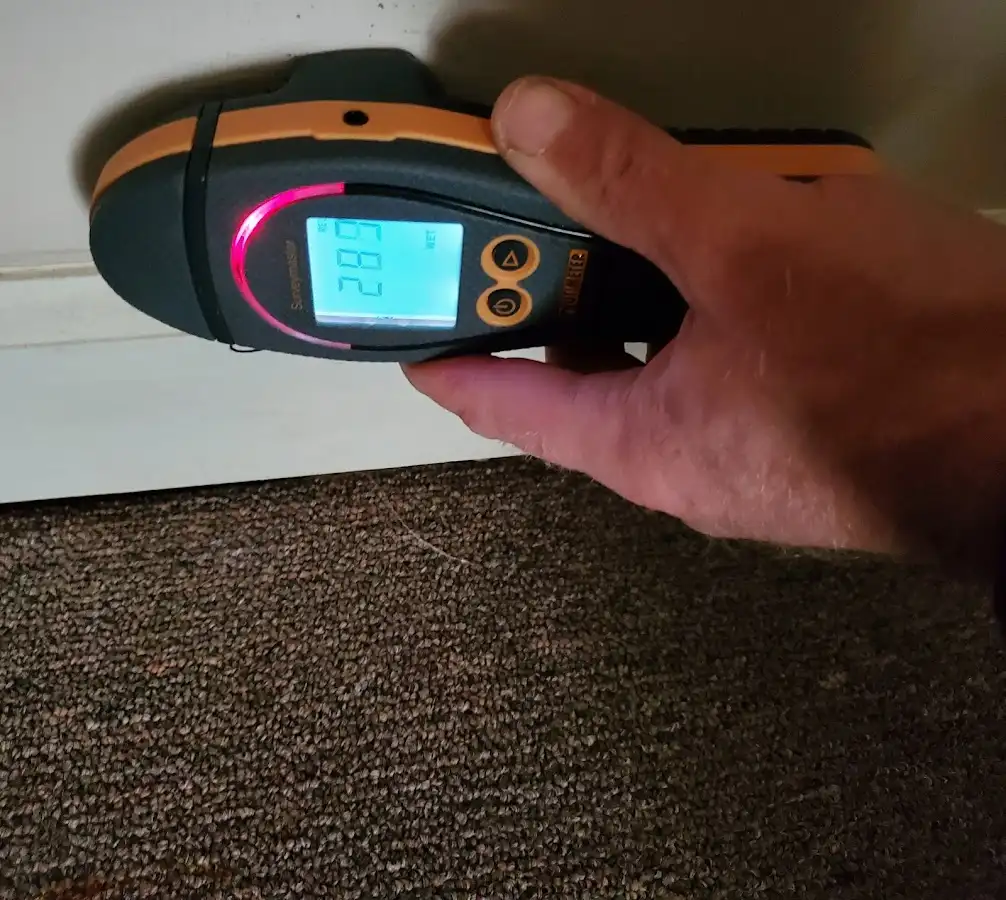 Moisture detection at baseboard during Burst Pipe Cleanup in East Windsor
